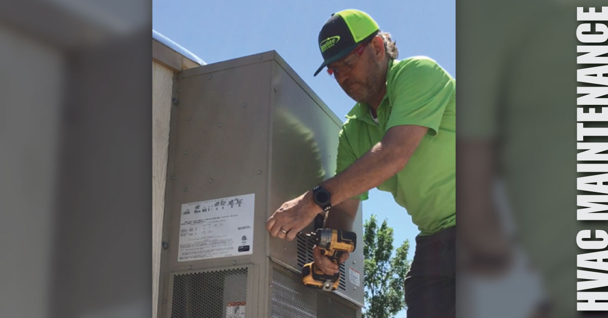 A man working on an HVAC unit